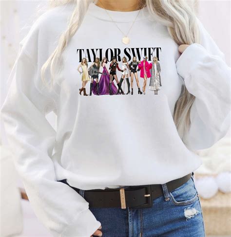  TAYLOR SWIFT MERCH Holiday Collection Sweaters/Hoodies T-Shirt Cardigan ... Taylor Swift The Eras Tour Taylor Swift evermore Album T-Shirt 36 Add to bag. 